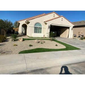 gravel landscape with plants and artificial turf